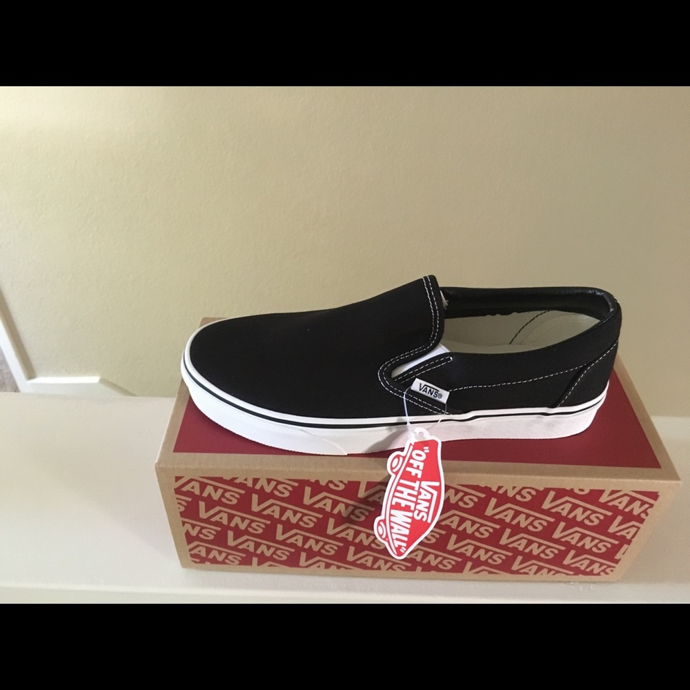 Vans black slip ons